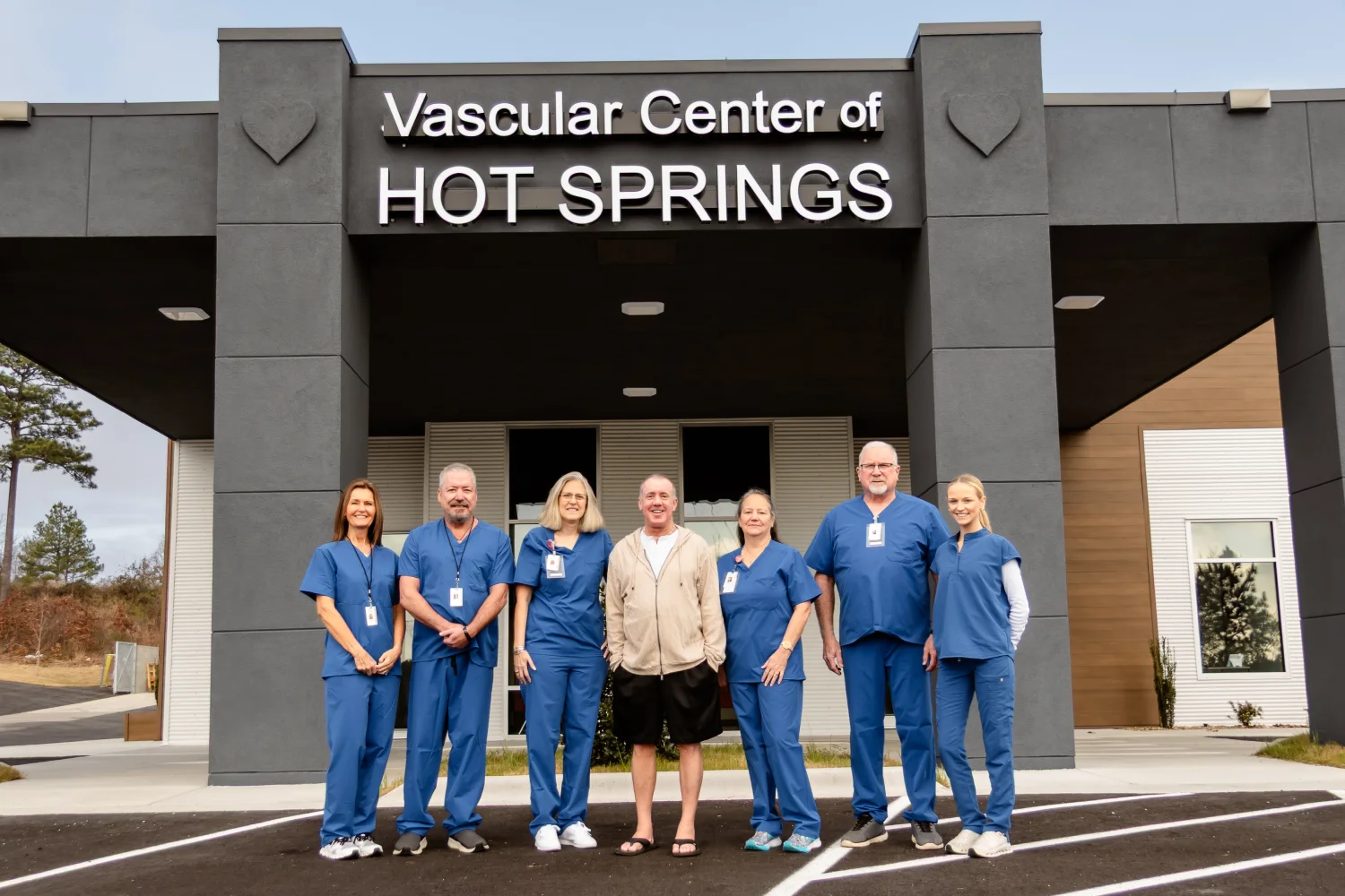Dr. Jeffrey Tauth and his team standing in front of the Vascular Center of Hot Springs facility.